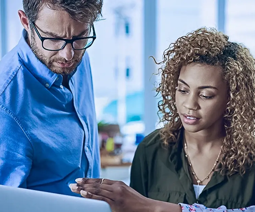 woman showing man laptop